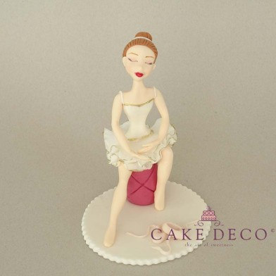Cake Deco Ballerina sitting on a stool